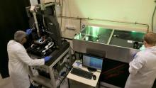 ANU researchers aligning a laser